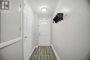 Brampton (Brampton West) townhouse for rent - A hallway with a door and a light on the wall.