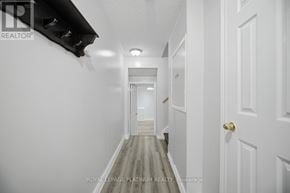 Brampton (Brampton West) townhouse for rent - A long hallway with white walls and doors on both sides.
