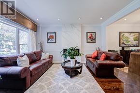 Toronto (Leaside) apartment for rent - A living room with brown leather couches and a coffee table.