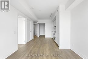Toronto (Thorncliffe Park) condo for rent - A spacious, empty room with wooden floors and white walls.