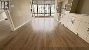 Richmond apartment for rent - A room with wooden flooring and white walls, with a window in the background.