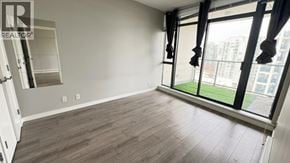Richmond apartment for rent - A room with a sliding glass door leading to a balcony.