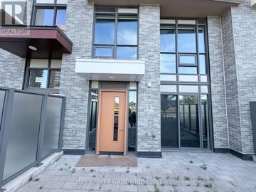 Toronto (Bayview Village) townhouse for rent - A building with a Bay Street Group Inc. sign on the front.