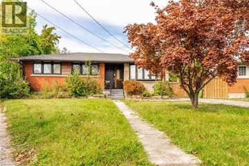Hamilton apartment for rent - A house with a tree in front of it.