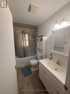 Toronto (Newtonbrook West) apartment for rent - A bathroom with a toilet, sink, and shower.