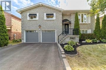 Clarington (Courtice) apartment for rent - A two-story house with a garage and a front yard.