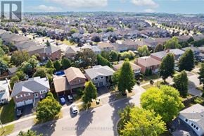 Clarington (Courtice) apartment for rent - A bird's eye view of a residential neighborhood with houses and trees.