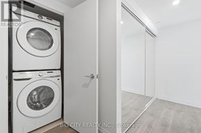 Toronto (Thorncliffe Park) condo for rent - A white washing machine and dryer in a laundry room.