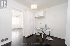 St. Catharines (Old Glenridge) apartment for rent - A dining room with a glass table and white chairs.