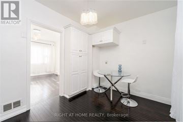 St. Catharines (Old Glenridge) apartment for rent - A dining room with a glass table and white chairs.