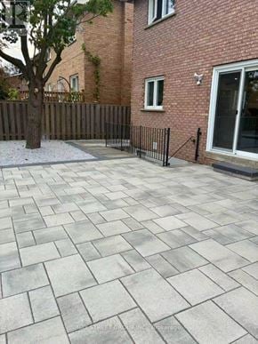 Markham (Aileen-Willowbrook) apartment for rent - A patio with a grey tiled surface and a black fence.