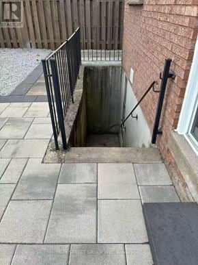 Markham (Aileen-Willowbrook) apartment for rent - A manhole in a sidewalk with a metal railing.
