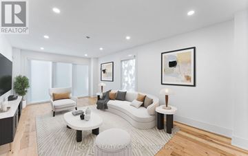Mississauga (Erin Mills) apartment for rent - A modern living room with a white sofa set, a coffee table, and a large painting on the wall.