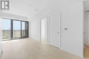 Toronto (Thorncliffe Park) condo for rent - A spacious room with a sliding glass door leading to a balcony.