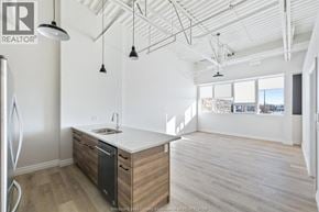 Lasalle apartment for rent - A kitchen with a white countertop and wooden cabinets.