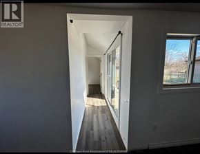 Shrewsbury apartment for rent - A hallway with a doorway leading to another room.