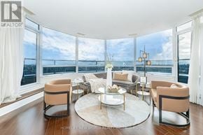 Markham (Unionville) condo for rent - A living room with a large window overlooking the water.