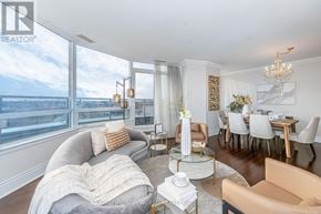 Markham (Unionville) condo for rent - A living room with a grey couch and a glass coffee table.