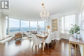 Markham (Unionville) condo for rent - A dining room with a table set for six with a view of the water outside.