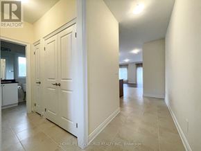 Georgina (Sutton & Jackson's Point) apartment for rent - A hallway with white doors and tiled floors.