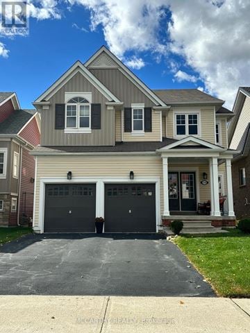 Shelburne apartment for rent - A two-car garage is attached to a house.