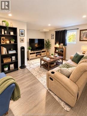 Tecumseh apartment for rent - A living room with a blue couch and a beige sofa.