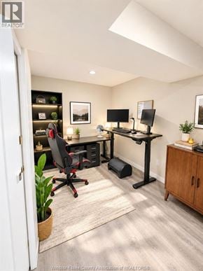 Tecumseh apartment for rent - A home office with a desk, chairs, and a computer setup.