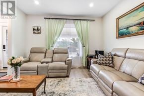 St. Thomas apartment for rent - A living room with a leather couch, a sofa, and a coffee table.