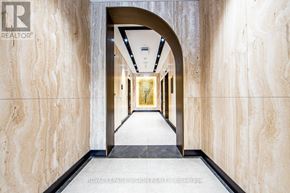 Toronto (Waterfront Communities) condo for rent - A hallway with a logo that says REALTOR on the wall.