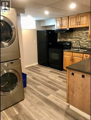 Lethbridge apartment for rent - A laundry room with a washer and dryer.