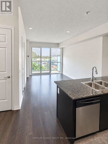 Toronto (Downsview-Roding-Cfb) condo for rent - A kitchen with a sink and a dishwasher.