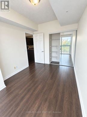 Toronto (Downsview-Roding-Cfb) condo for rent - A room with wood flooring and white walls.