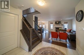 London North (North S) apartment for rent - A living room with a staircase and a couch.