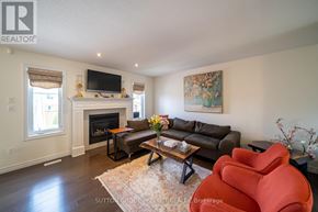 London North (North S) apartment for rent - A living room with a fireplace and a flat screen TV mounted on the wall.