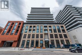 Hamilton (Beasley) condo for rent - A modern building with a car parked in front of it.