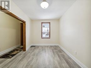 Toronto (Yorkdale-Glen Park) apartment for rent - A room with a wooden floor and a window.