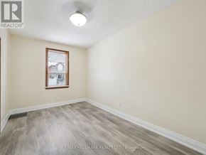 Toronto (Yorkdale-Glen Park) apartment for rent - A room with a window and wooden flooring.