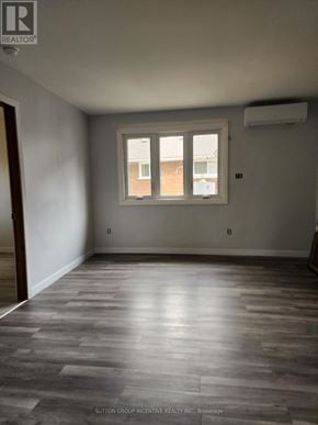 Cambridge apartment for rent - A room with a window and wooden flooring.