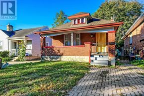 London East (East M) apartment for rent - A house with a red brick facade and a white roof is shown.