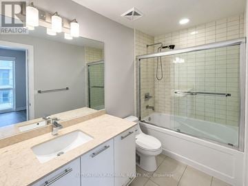 Richmond Hill (Observatory) condo for rent - A bathroom with a sink, toilet, and bathtub.