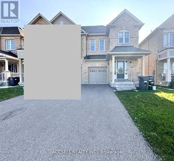 Brampton (Credit Valley) apartment for rent - A house with a driveway in front of it and a sign that says "REALTOR".