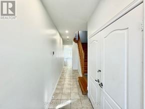Brampton (Credit Valley) apartment for rent - A hallway with a staircase and white walls.