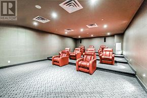 Mississauga (City Centre) condo for rent - A room with a row of red chairs and a grey floor.