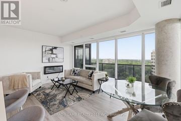 Mississauga (Clarkson) house for rent - A living room with a glass table and a couch.