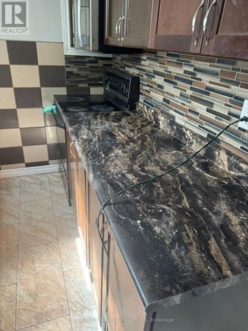 Kitchener apartment for rent - A kitchen counter with a black appliance on it.