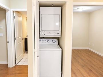 Surrey apartment for rent - A white dishwasher is installed in a kitchen.