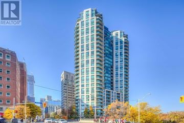 Toronto (Rosedale-Moore Park) condo for rent - A tall building with many windows is the focal point of the image.