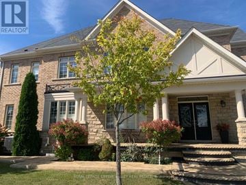 Brampton (Credit Valley) apartment for rent - A house with a tree in front of it.