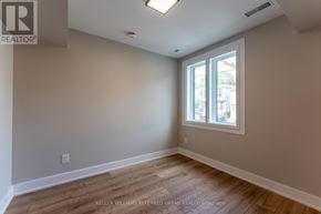 Toronto (Blake-Jones) apartment for rent - A room with a window and wooden flooring.