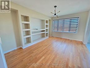 Haldimand apartment for rent - A room with wooden flooring and a window with blinds.